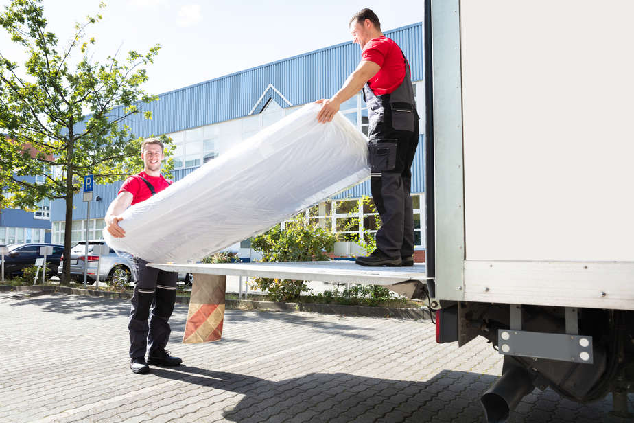 בסט לינק  depositphotos Young Men Unloading The Mattress From Truck On Street